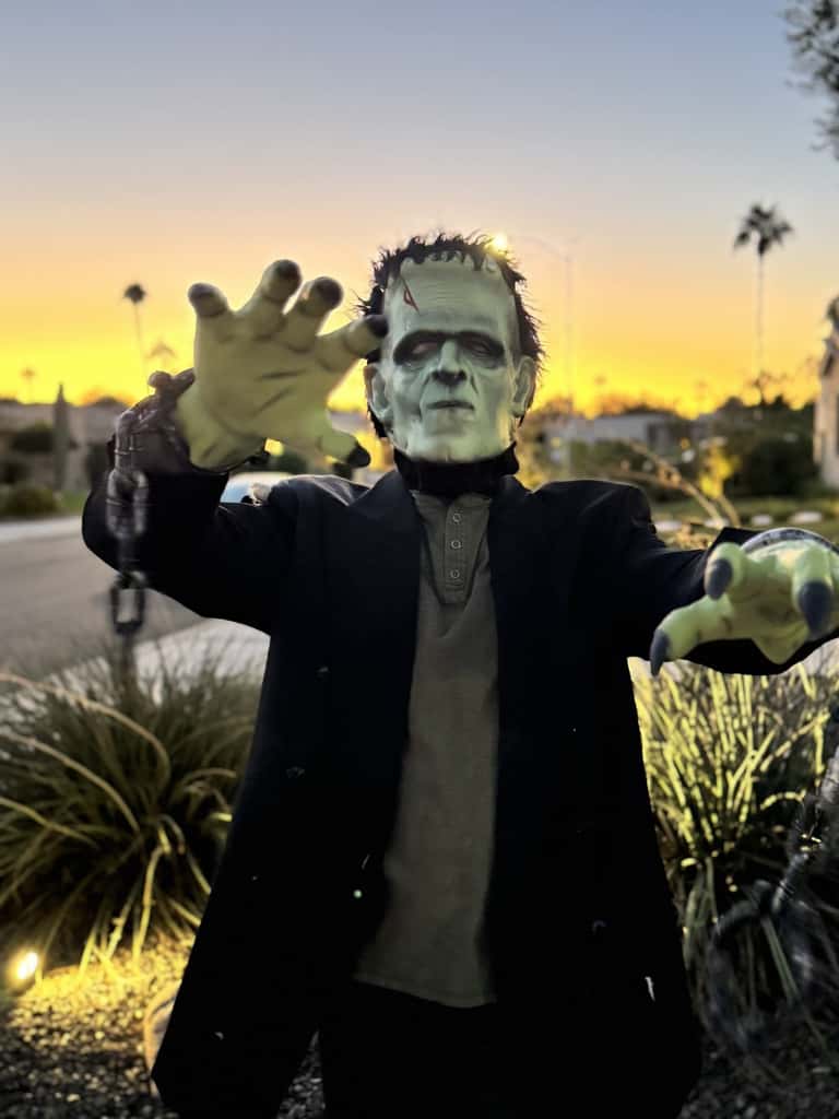 Frankenstein's monster reaches toward the camera against an Arizona sunset